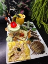 BRUNCH (Jusqu'à 17h) La signature DELIV - La Tuniserie "Commandez en ligne chez La Tuniserie et régalez-vous avec nos brunchs gourmands, burgers généreux et plats maison, livrés directement chez vous, sans compromis sur la qualité."