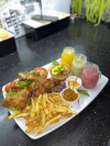 LES KRUNCHS Krunch Cuisse DELIV - La Tuniserie "Commandez en ligne chez La Tuniserie et régalez-vous avec nos brunchs gourmands, burgers généreux et plats maison, livrés directement chez vous, sans compromis sur la qualité."